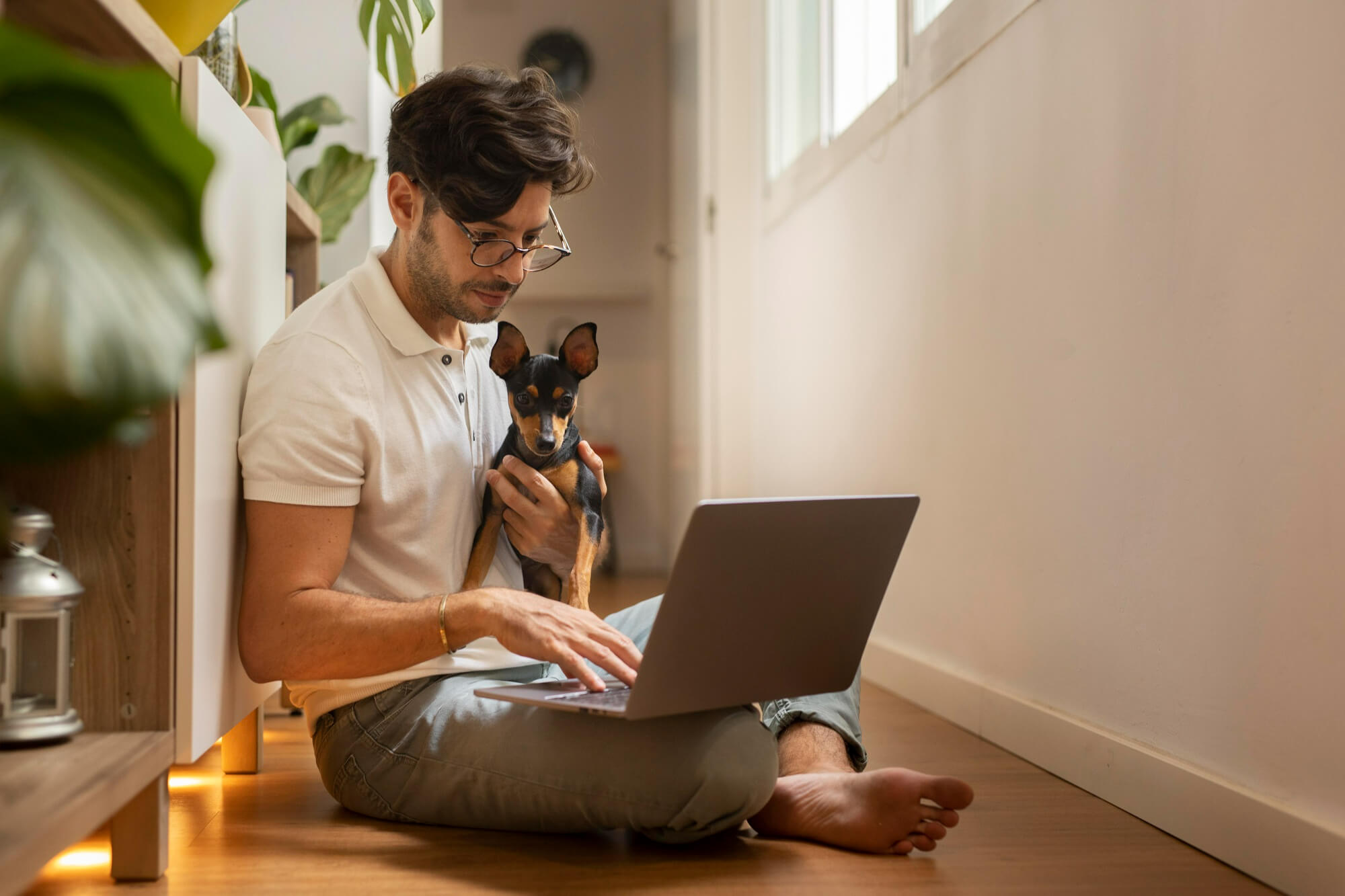 person-working-from-home-with-pet-dog