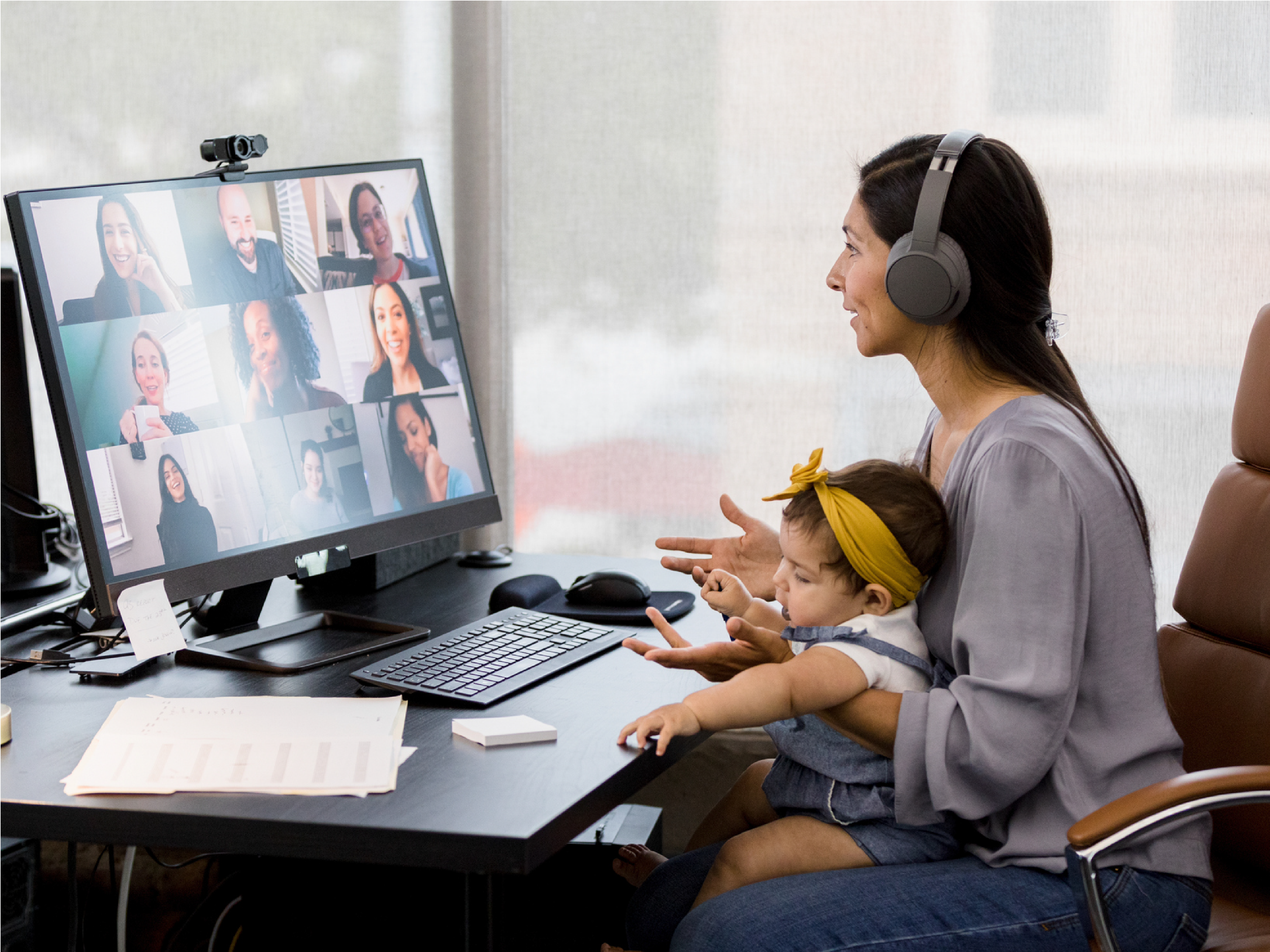 working mom with a kid in a virtual call