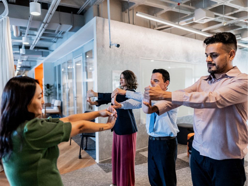 Employees exercising in their office.